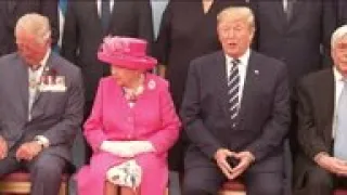 Queen meets Merkel at D-Day event, family photo