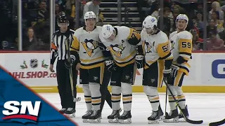 Evgeni Malkin Scores But Leaves Game Injured After Sidney Crosby's Slapshot Deflects In Off Knee