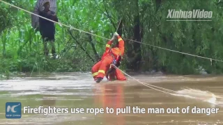 Breathtaking rescue! Elderly man trapped on island saved by firefighters in SW China's Yunnan