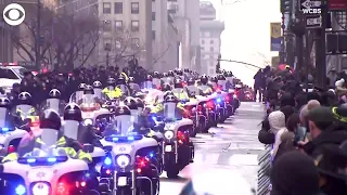 WEB EXTRA: Police Officers And Members Of The Public Line NYC Street After NYPD Officer's Funeral