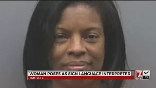 Woman poses as sign language interpreter