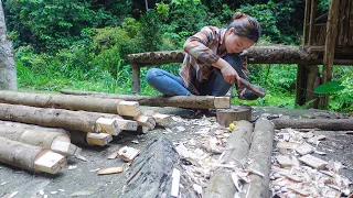 Building wooden hut - process of chiseling & assembling wooden hut