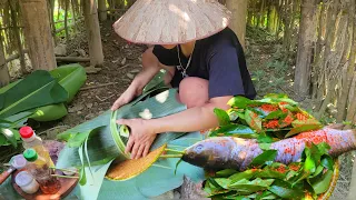 Grass carp wrapped in 1000 banana leaves grilled directly over fire
