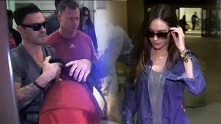 Megan Fox And Brian Austin Green Arrive With Baby Noah At LAX, Fox Asked About Plastic Surgery