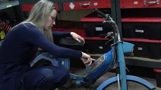 She is re-building an old PEUGEOT 103 moped (mobylette 1971)