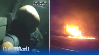 Police officer rescues unconscious driver from burning truck moments before explosion