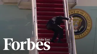 President Biden trips going up the stairs of Air Force One