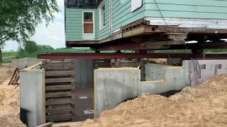 Old house moving onto new foundation