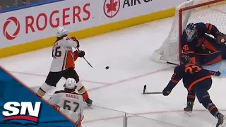 Trevor Zegras Banks Puck Off Mike Smith's Back To Score From Sharp Angle