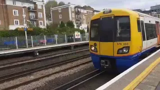 Trains at Kensington Olympia Station  Saturday,  20 Apr 2024.