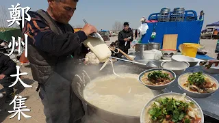 At a rural market in China, the noodle chef has superb knife skills