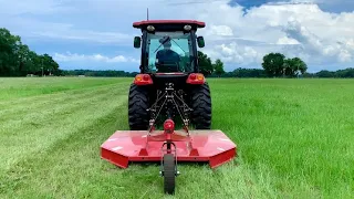 Explaining the RK37 shuttle shift transmission while mowing the hay field