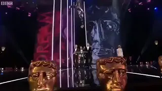 Taron Egerton, Richard Madden and Jamie Bell presenting at the #BAFTAs