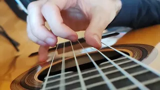 Slow-motion classical guitar without nails