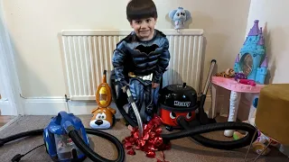 Batman Boy enjoys Vacuuming a room filled with Tinsel with Red Henry Hoover and Bissel