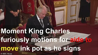 Moment King Charles furiously motions for aide to move ink pot as he signs proclamation