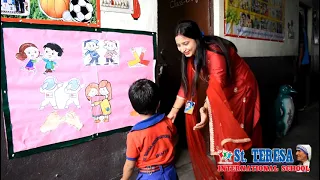 STIS Teacher greeting her class with special handshakes &hugs before class !