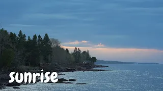 sunrise on Lake Superior on a day sandwiched by a Great Lakes ship (laker) – waves and morning birds