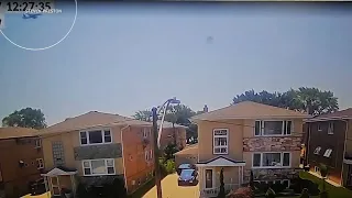 CAUGHT ON CAMERA: Emergency slide falls from plane, lands in backyard