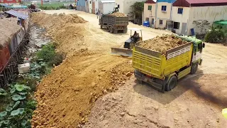 Amazing work! Dumping Dump Truck Landfill over the muddle with Bulldozer Mitsubishi