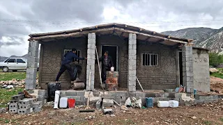 Cementing the house of a nomadic man with his daughter and the support of the cameraman