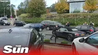 Dramatic moment UK armed cops swoop in on Audi in North London