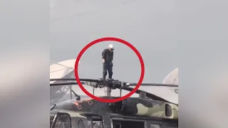 Man Flies Up ￼On A Helicopter Rotor