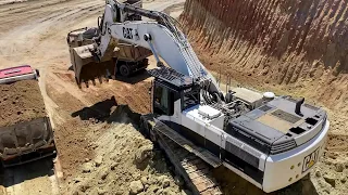 Caterpillar 375 Excavator Loading Trucks