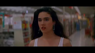 Jennifer Connelly in Tight Black Jeans Rollerblading in Target Scene in Career Opportunities (1991)