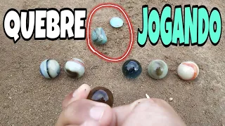 Como jogar bolinha de gude com muita força