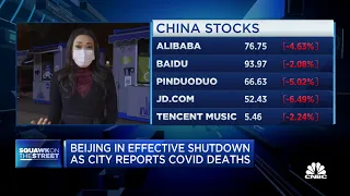 Beijing in effective shutdown as the city reports Covid deaths