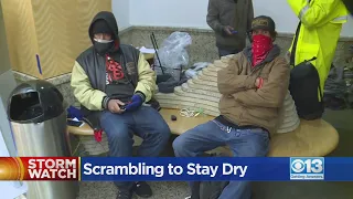 Homeless Residents Take Advantage Of City Hall Lobby To Stay Dry