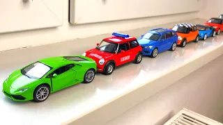 Diecast Cars Moving By Hand On The Windowsill