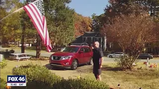 Video shows FedEx driver see fallen American flag in Matthews front yard, hangs it back up, gives bi