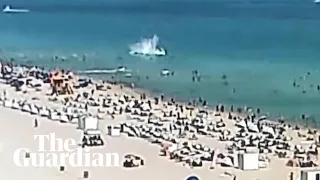 Helicopter crashes into ocean at crowded Miami Beach, injuring two