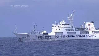 Chinese ship blocks Philippine vessel as journalists watch