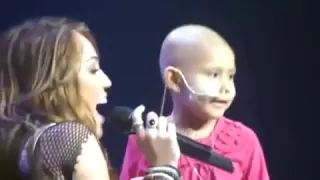 Concert of Hope Miley Cyrus "The Climb" Miley brought a little girl on stage