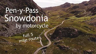 Riding the Pen-y-Pass in Snowdonia on a Triumph Bonneville T120 motorcycle.