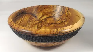 Wood turning a   power tool texturing and painting olive wood bowl