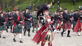 Scottish Highland Pipe Bands parade outside Dunrobin Castle in Sutherland for charity April 2019