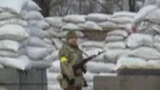 People guard checkpoint outside Kyiv