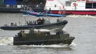 Royal Marines power down the Thames as they practise for a live firearms demonstration tomorrow
