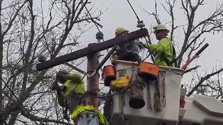 EWEB Linemen repair insulator after ice storm