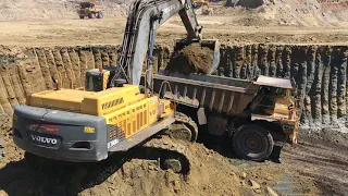 Volvo EC700B Excavator Loading Caterpillar Dumpers