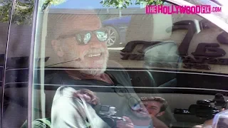 Arnold Schwarzenegger Laughs At Paparazzi While Running Out Of The Palm Restaurant In Beverly Hills