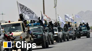 Taliban fighters show off captured military hardware in the Afghan city of Kandahar