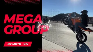 Mega group of motorcycle stunts having a ride