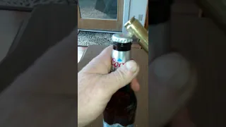 Opening bottle cap with 50 caliber dormant round