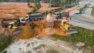 Urgent Working Landfill Large field by Team Operator Bulldozer Push Stone with Truck Unloading Stone