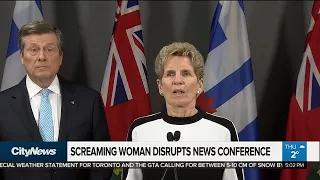 Woman's screaming interrupts City Hall press conference